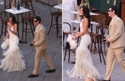 Dua Lipa stuns in backless ivory dress with feather details at Italy celebrations