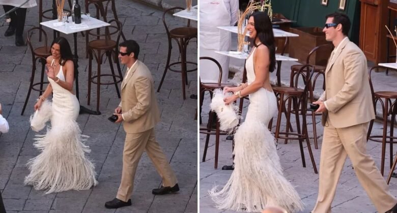 Dua Lipa stuns in backless ivory dress with feather details at Italy celebrations